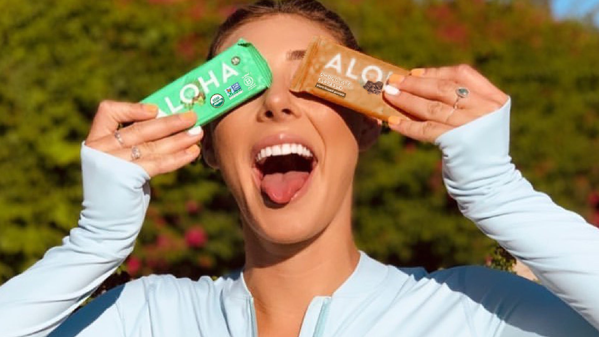 Woman athlete deciding when to eat a protein bar