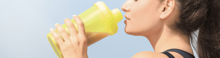 Person drinking from ALOHA’s Chocolate Protein Powder