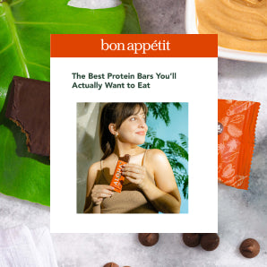 Woman holding plant-based protein bar